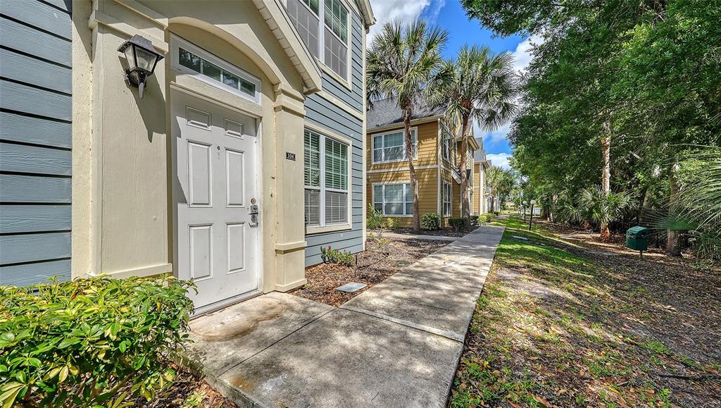 5561 Rosehill Road, Unit 104 Sarasota, FL 34233 - Photo 4 of 53 a view of a house with a yard