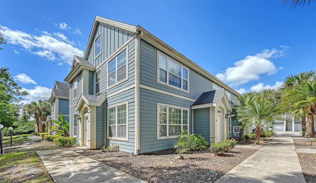 5561 Rosehill Road, Unit 104 Sarasota, FL 34233 - Photo 41 of 53 a view of a house with a yard