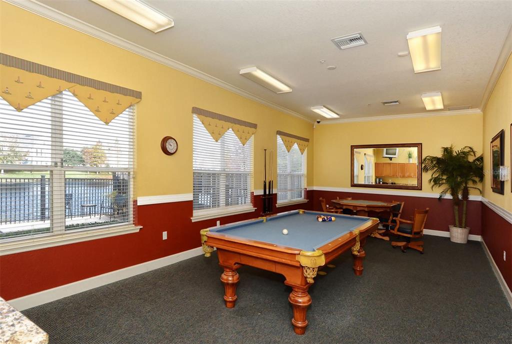 5561 Rosehill Road, Unit 104 Sarasota, FL 34233 - Photo 49 of 53 a room with pool table and windows