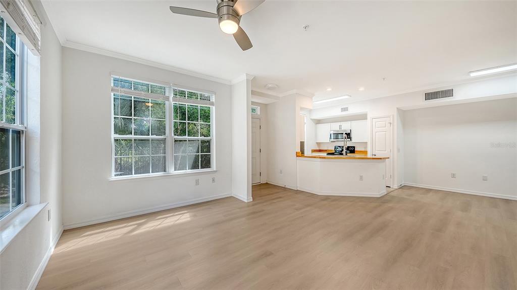 5561 Rosehill Road, Unit 104 Sarasota, FL 34233 - Photo 5 of 53 an empty room with a empty space and windows