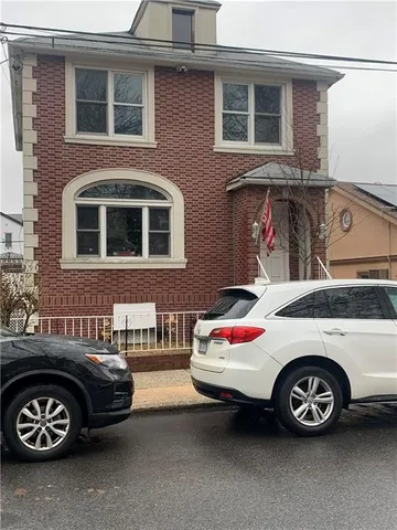 a car parked in front of a house