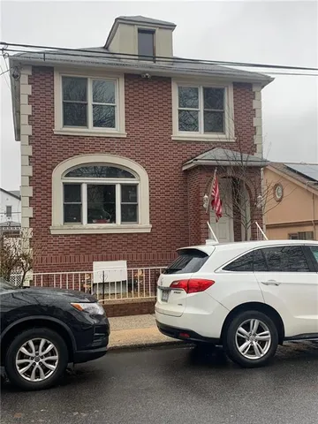 a front view of a house with parking space