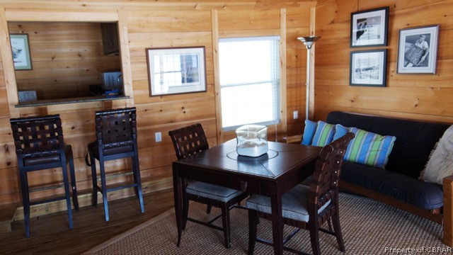 1167 Johns Neck Road Weems, VA 22576 - Photo 26 of 48 a view of a dining room with furniture and wooden floor