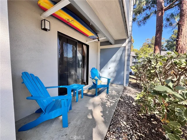 a view of a chairs and table in the patio