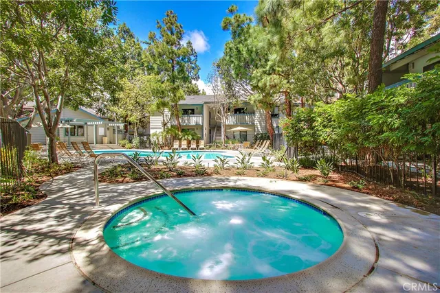 a view of a swimming pool with a sitting area