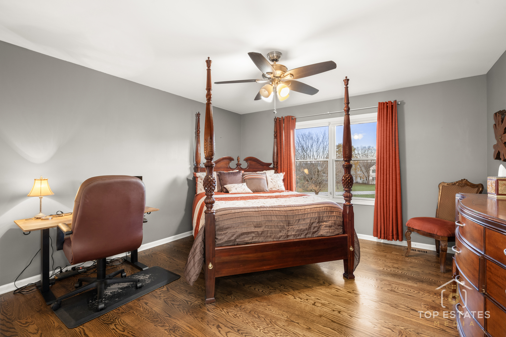 2303 Fox Bluff Lane Spring Grove, IL 60081 - Photo 28 of 39 a bedroom with a bed a chair and a chandelier