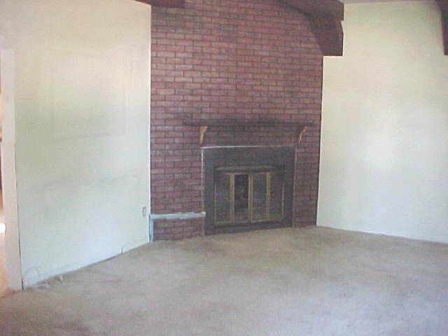 2731 West Florence Road Freeport, IL 61032 - Photo 4 of 6 a view of empty room with a fireplace