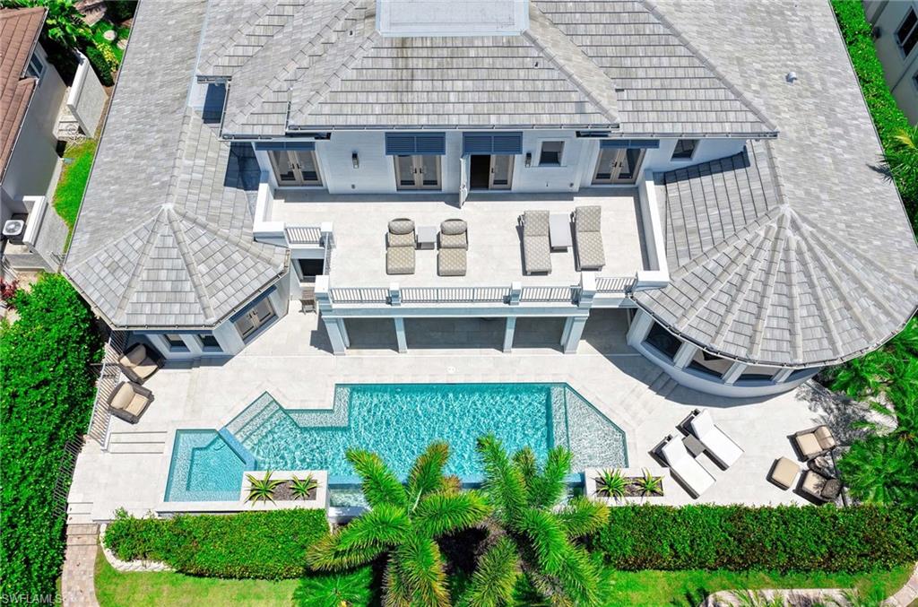 1888 6th Street South Naples, FL 34102 - Photo 2 of 37 an aerial view of a house with balcony and garden
