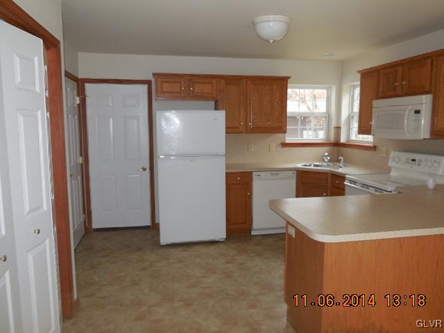 402 Mountain Road Albrightsville, PA 18210 - Photo 3 of 11 a kitchen with a sink and refrigerator