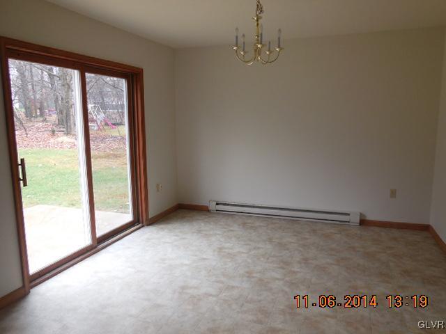 402 Mountain Road Albrightsville, PA 18210 - Photo 4 of 11 a view of an empty room with a window
