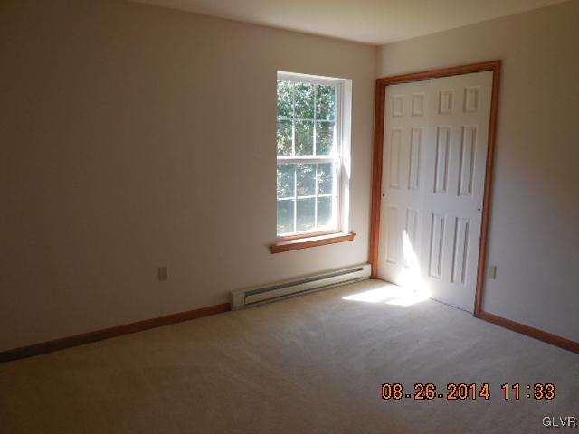 402 Mountain Road Albrightsville, PA 18210 - Photo 6 of 11 an empty room with windows
