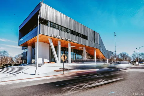 a front view of a building with parking space