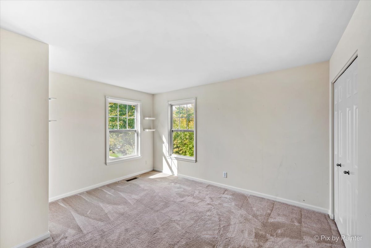 6-n307 Whitmore Circle, Unit A St. Charles, IL 60174 - Photo 11 of 18 an empty room with windows