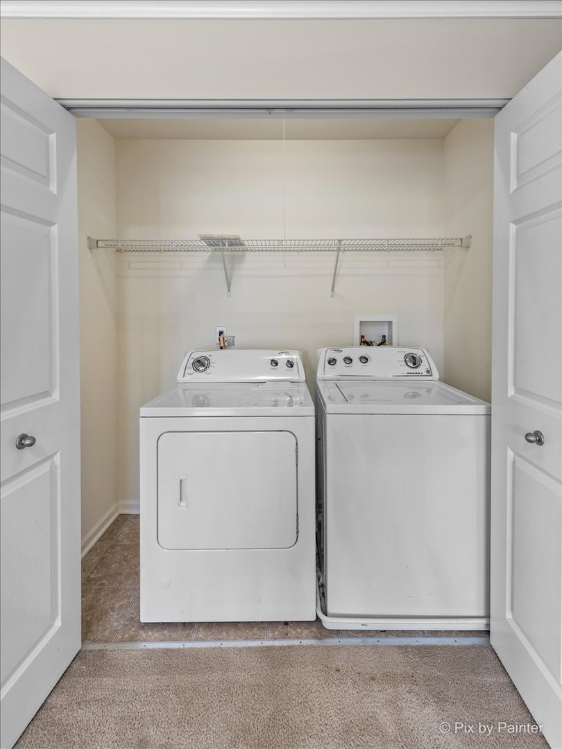 6-n307 Whitmore Circle, Unit A St. Charles, IL 60174 - Photo 15 of 18 a utility room with dryer and washer