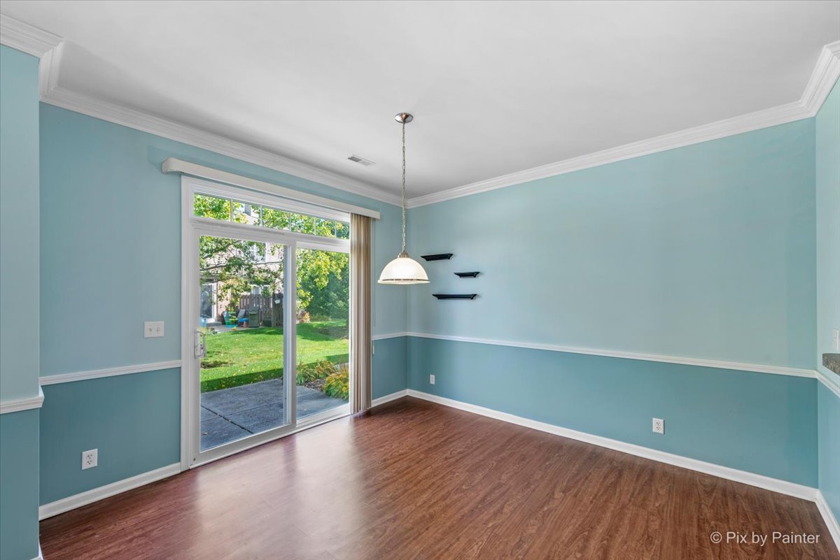 6-n307 Whitmore Circle, Unit A St. Charles, IL 60174 - Photo 6 of 18 a room with window and wooden floor