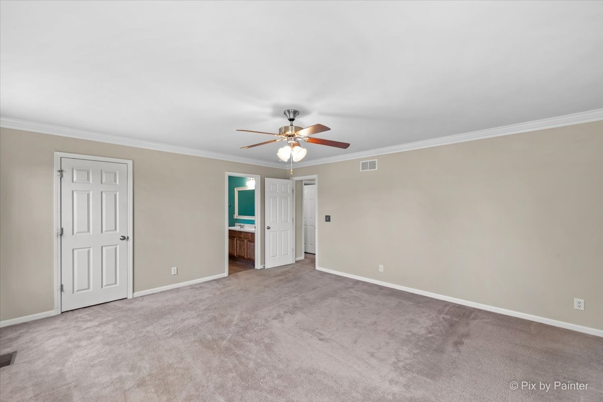 6-n307 Whitmore Circle, Unit A St. Charles, IL 60174 - Photo 9 of 18 a view of a livingroom with a ceiling fan and window