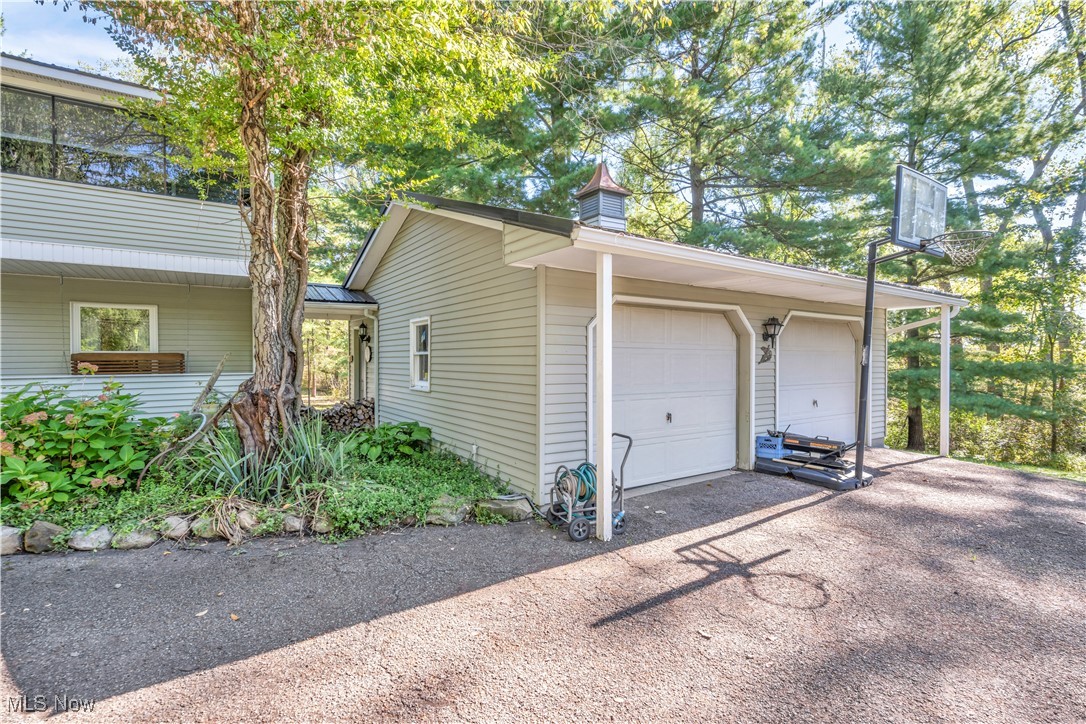 4032 Hanford Road Wakeman, OH 44889 - Photo 24 of 50 View of home's exterior with a carport and a garage