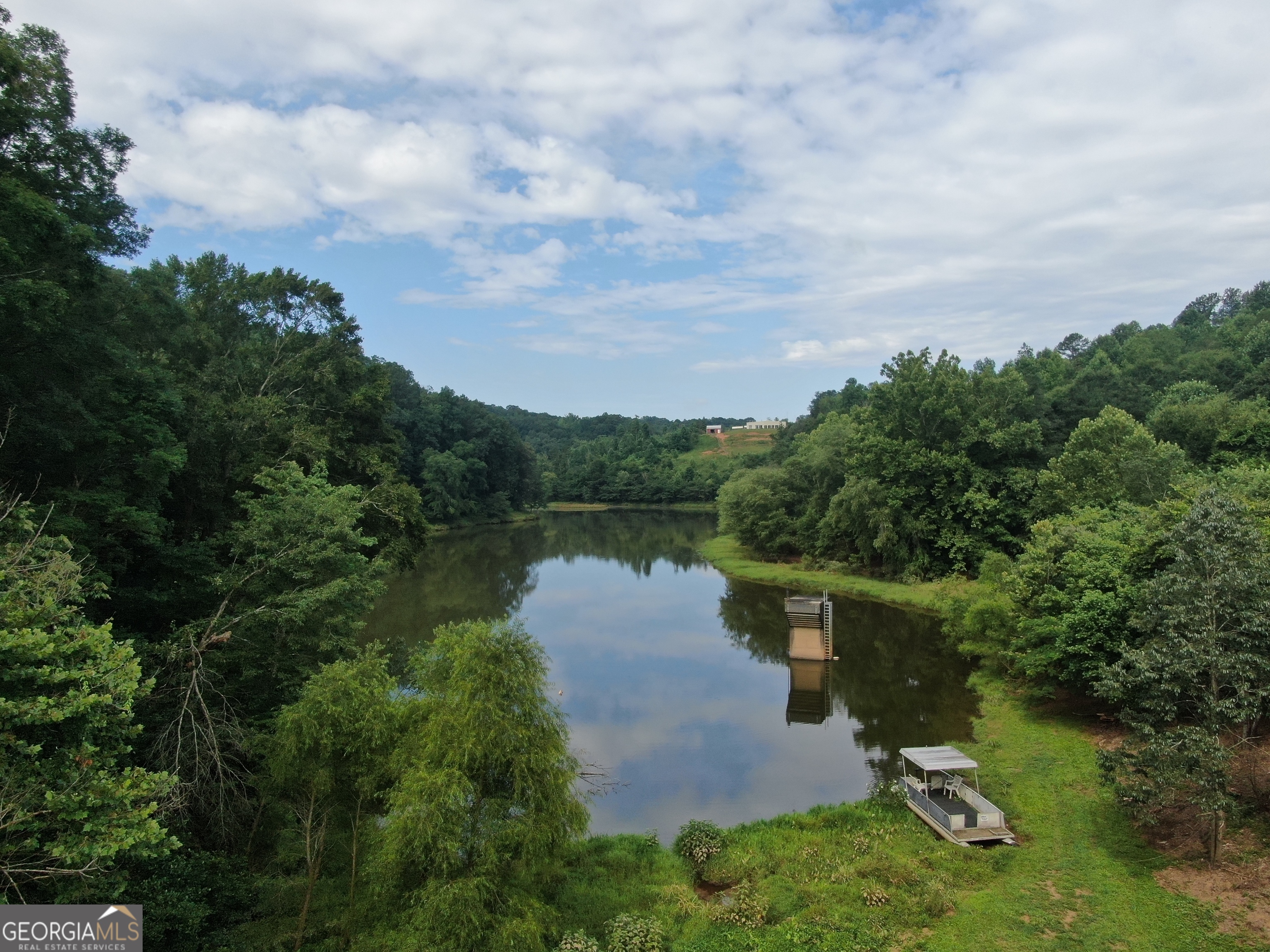 133 Summer Drive, Unit LOT 1 2 5 Baldwin, GA 30511 - Photo 1 of 1 aerial view of a house with a yard and lake view