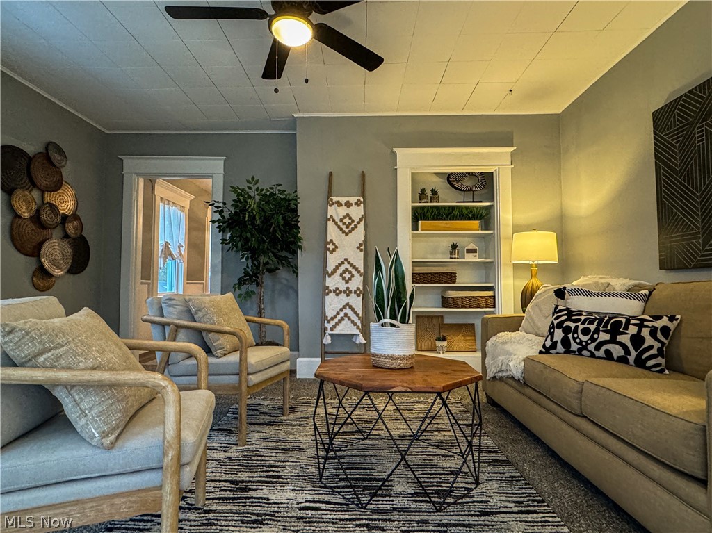 306 Robinson Road Campbell, OH 44405 - Photo 2 of 21 Carpeted living room featuring ceiling fan