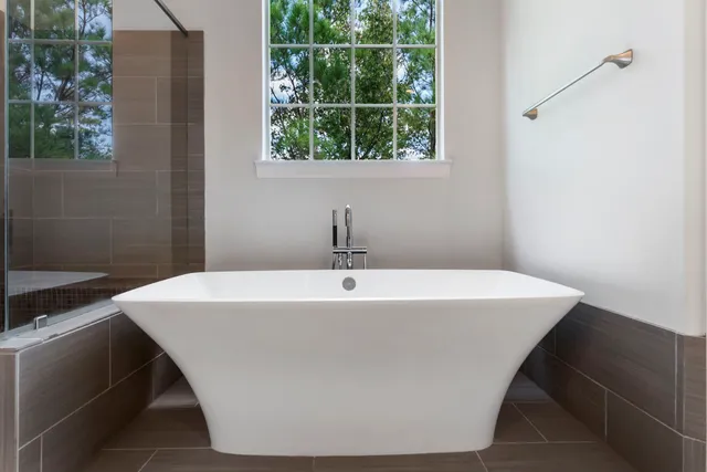 a white bath tub sitting in a bathroom