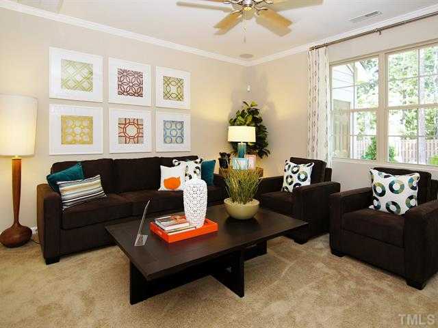 702 Wickham Ridge Road Apex, NC 27539 - Photo 3 of 10 a living room with furniture and a large window