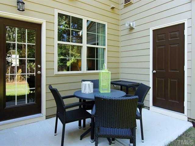 702 Wickham Ridge Road Apex, NC 27539 - Photo 7 of 10 a view of a dining room with a table and chairs