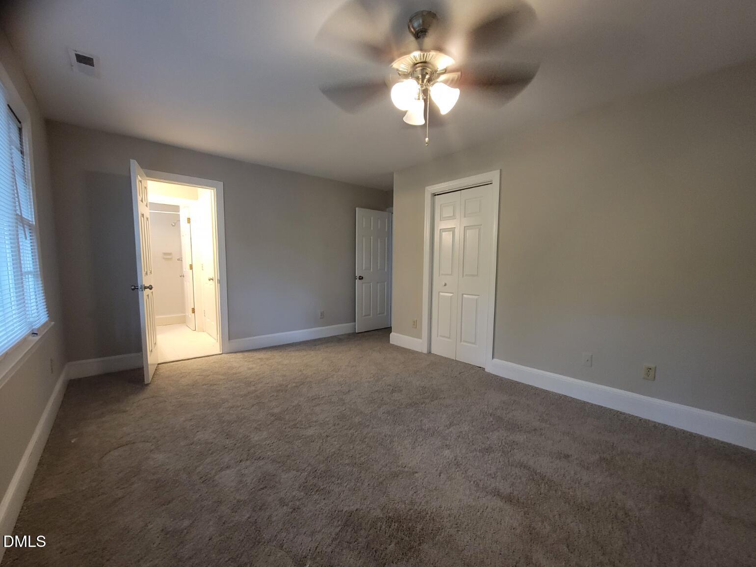 105 Leeward Court Cary, NC 27511 - Photo 15 of 27 an empty room with windows and fan