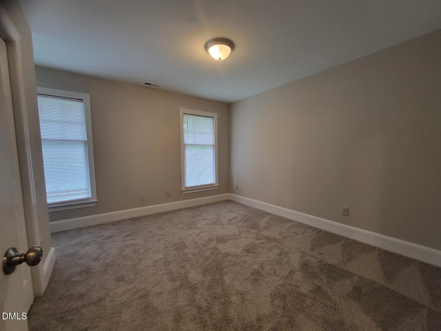 105 Leeward Court Cary, NC 27511 - Photo 18 of 27 an empty room with a window