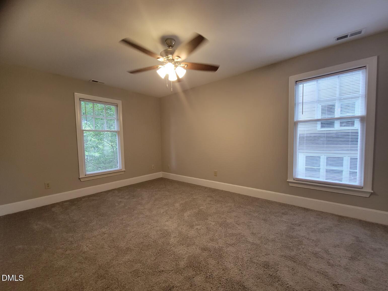 105 Leeward Court Cary, NC 27511 - Photo 20 of 27 a view of an empty room with a window