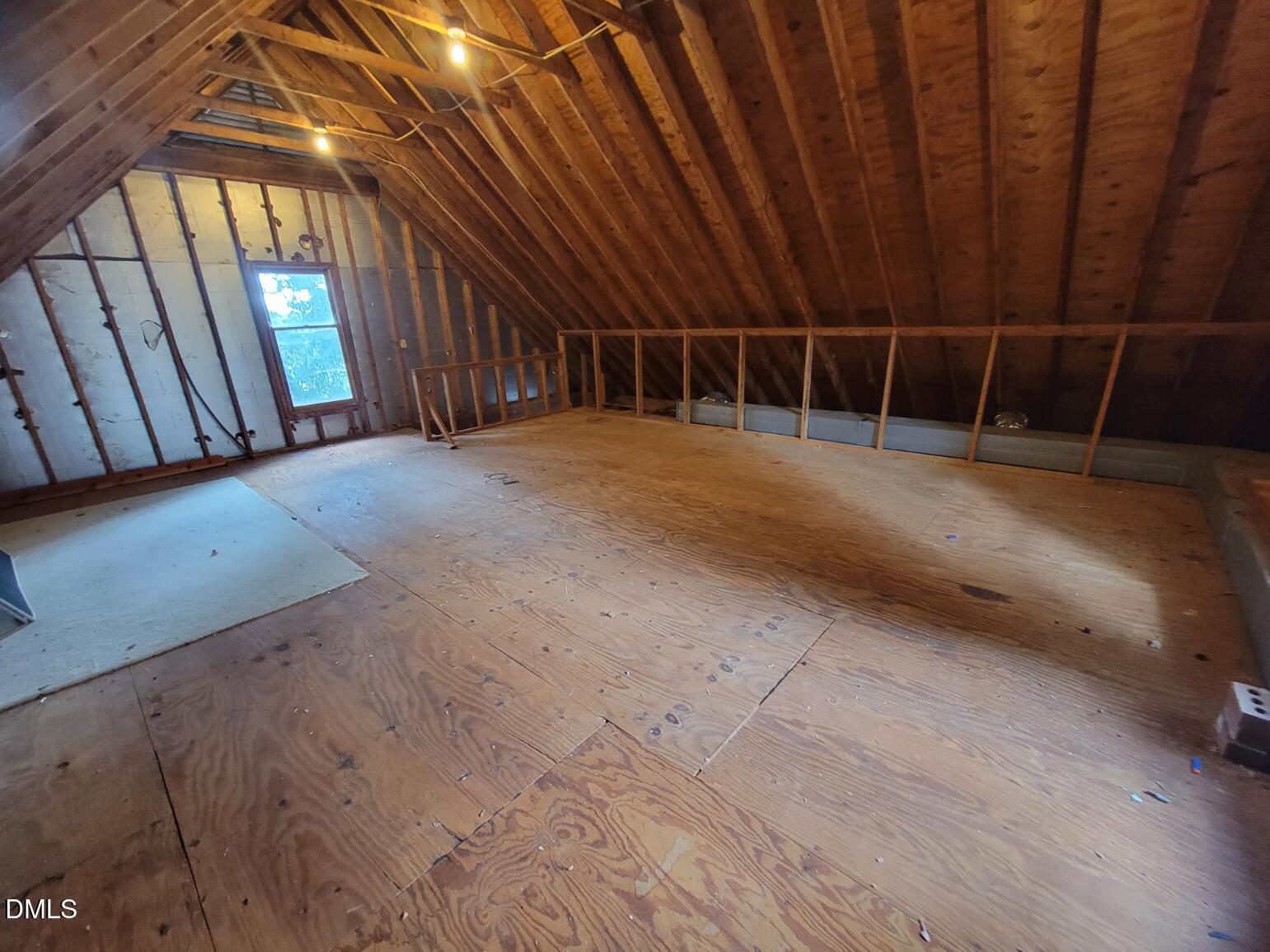 105 Leeward Court Cary, NC 27511 - Photo 23 of 27 a view of an empty room with wooden walls
