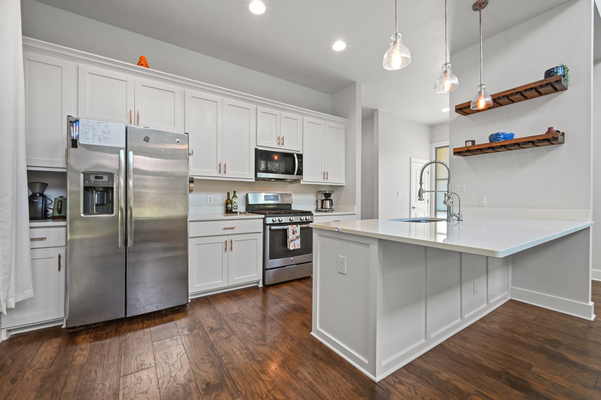 592 Farm To Market 967, Unit B Buda, TX 78610 - Photo 9 of 26 The heart of the home, this beautifully designed kitchen features stainless steel appliances, a spacious island, and an open-concept layout that makes entertaining effortless.