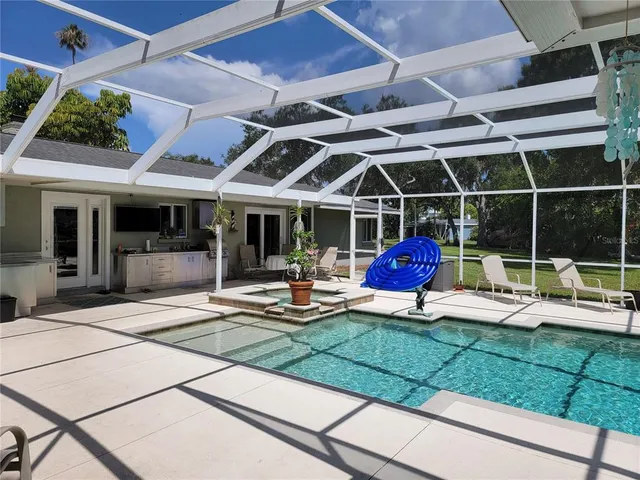 a view of a house with backyard and porch
