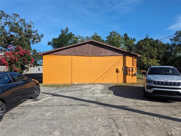 a view of a car parked on the side of a road