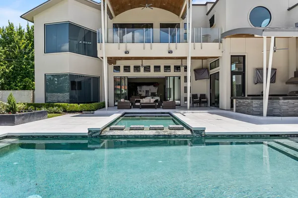 a swimming pool with outdoor seating yard and a patio