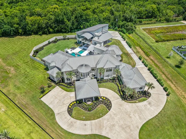 an aerial view of a house with outdoor space