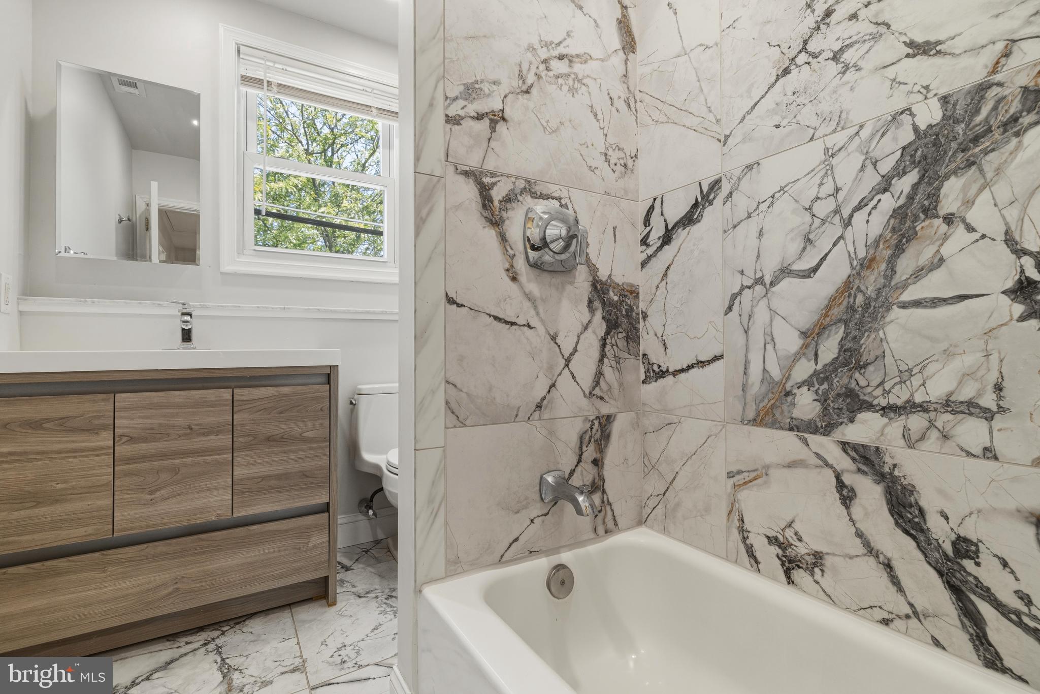 229 Wayne Avenue Narberth, PA 19072 - Photo 25 of 35 a bathroom with a bathtub and shower