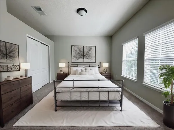 a bedroom with a bed and window