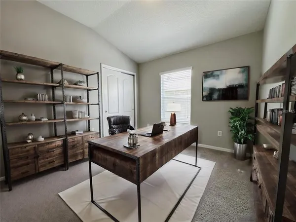a view of a workspace with furniture