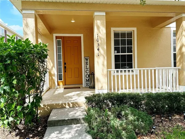 a front view of a house with a porch