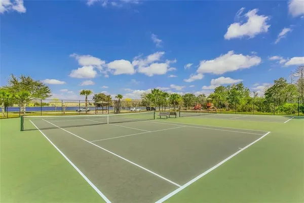 a view of an outdoor space and tennis court