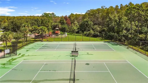 a view of an outdoor space and tennis court