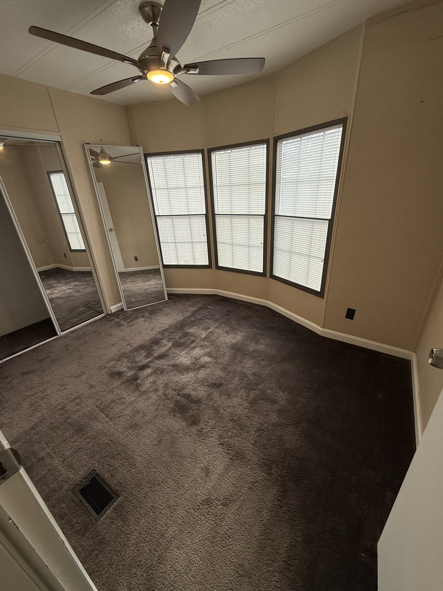 188 North Dogwood Street Trinity, TX 75862 - Photo 2 of 9 an empty room with windows