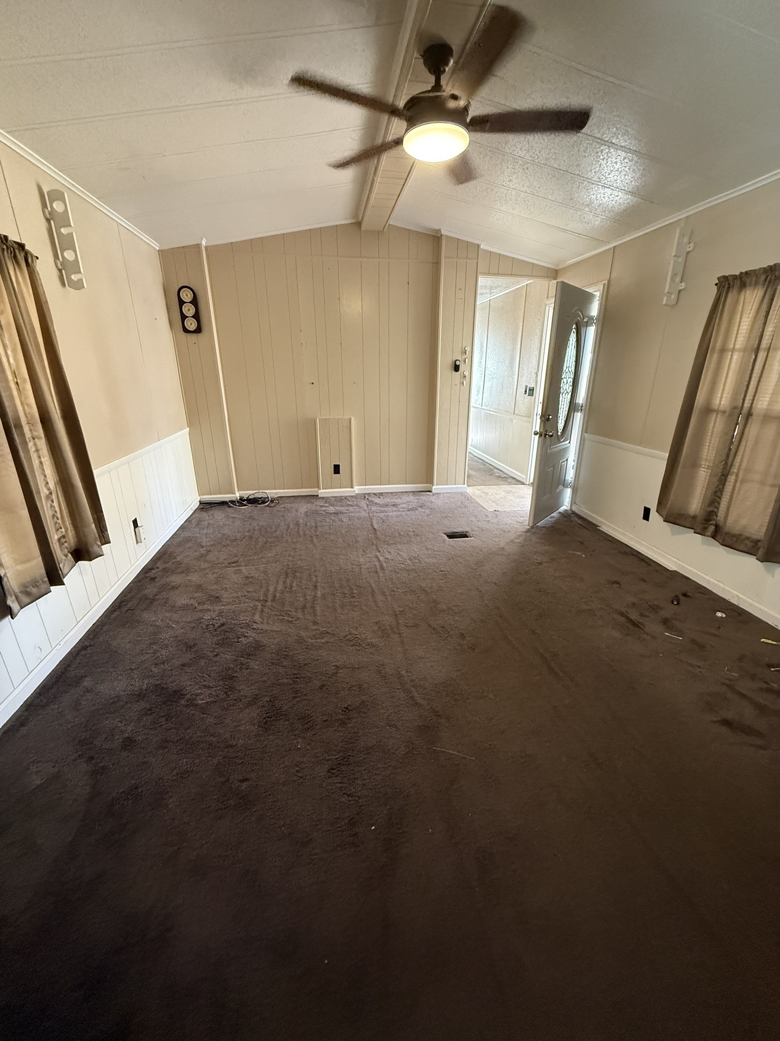 188 North Dogwood Street Trinity, TX 75862 - Photo 4 of 9 a view of a big room with staircase and windows