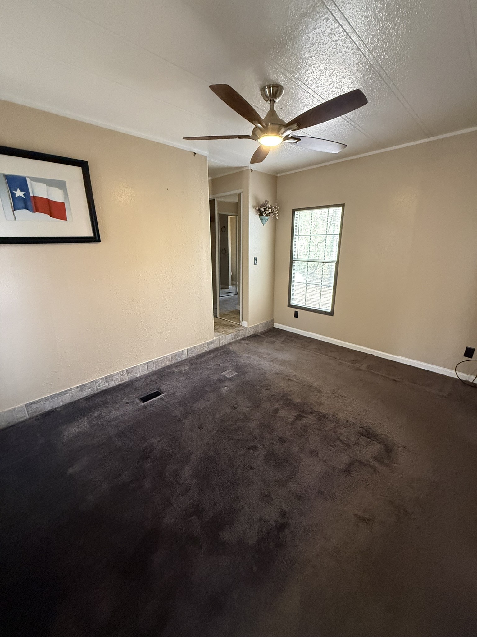 188 North Dogwood Street Trinity, TX 75862 - Photo 6 of 9 a view of an empty room with a window