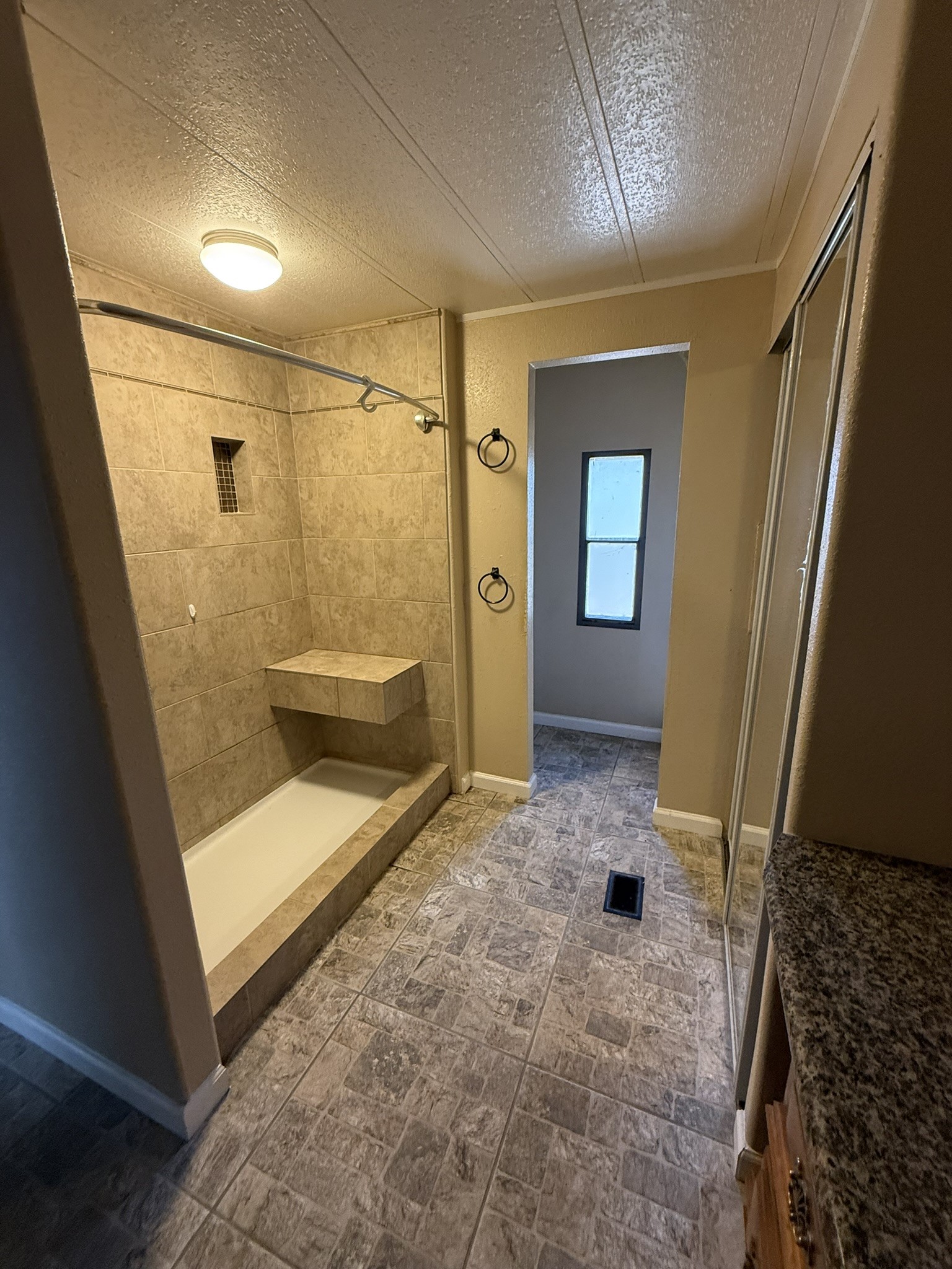 188 North Dogwood Street Trinity, TX 75862 - Photo 7 of 9 a bathroom with a glass door shower and a sink