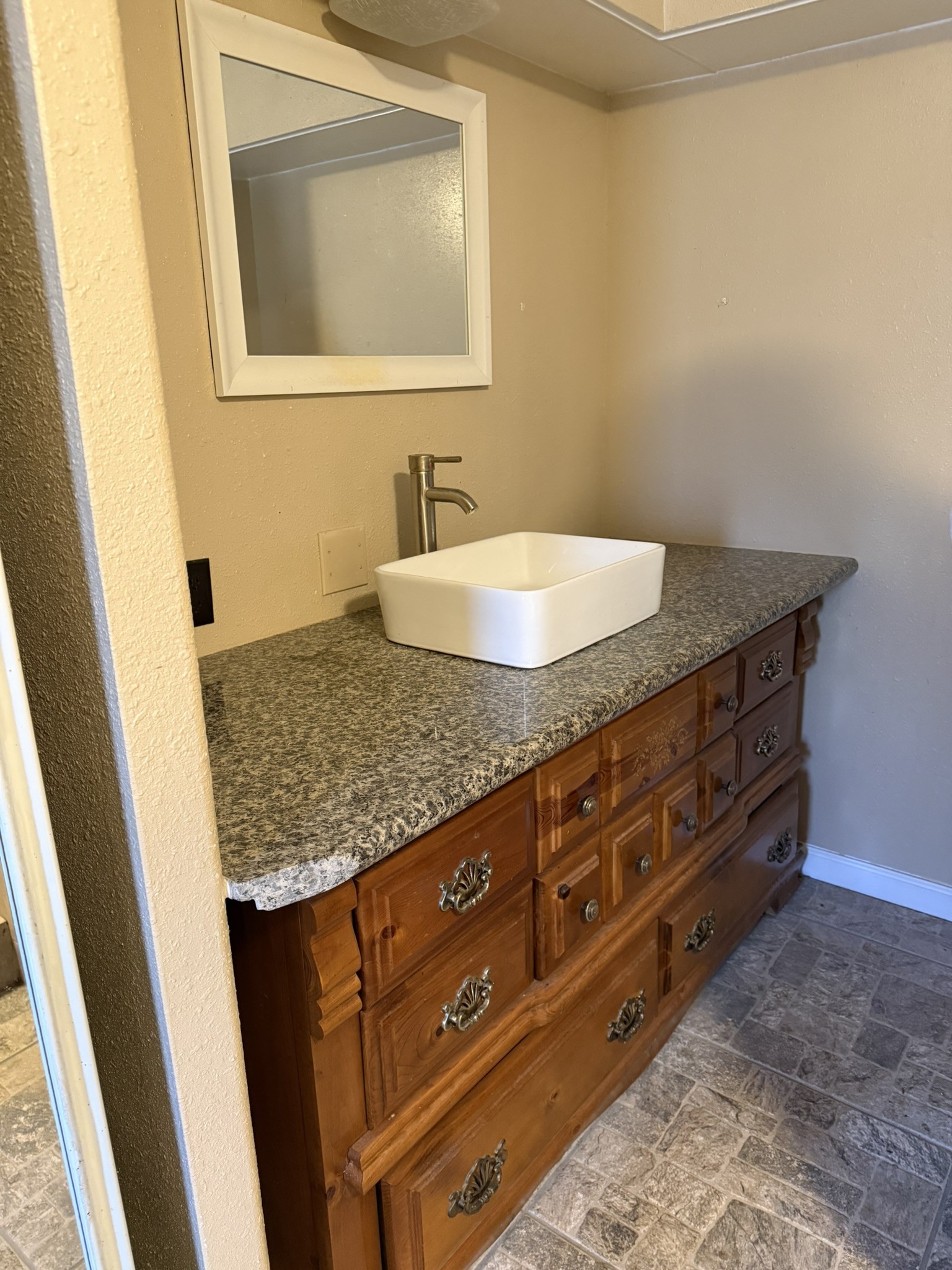 188 North Dogwood Street Trinity, TX 75862 - Photo 8 of 9 a bathroom with a granite countertop sink and a mirror