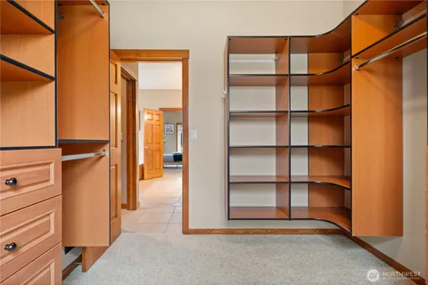 a view of an empty room and a window