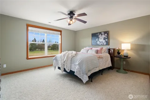 a bed room with a bed and a window