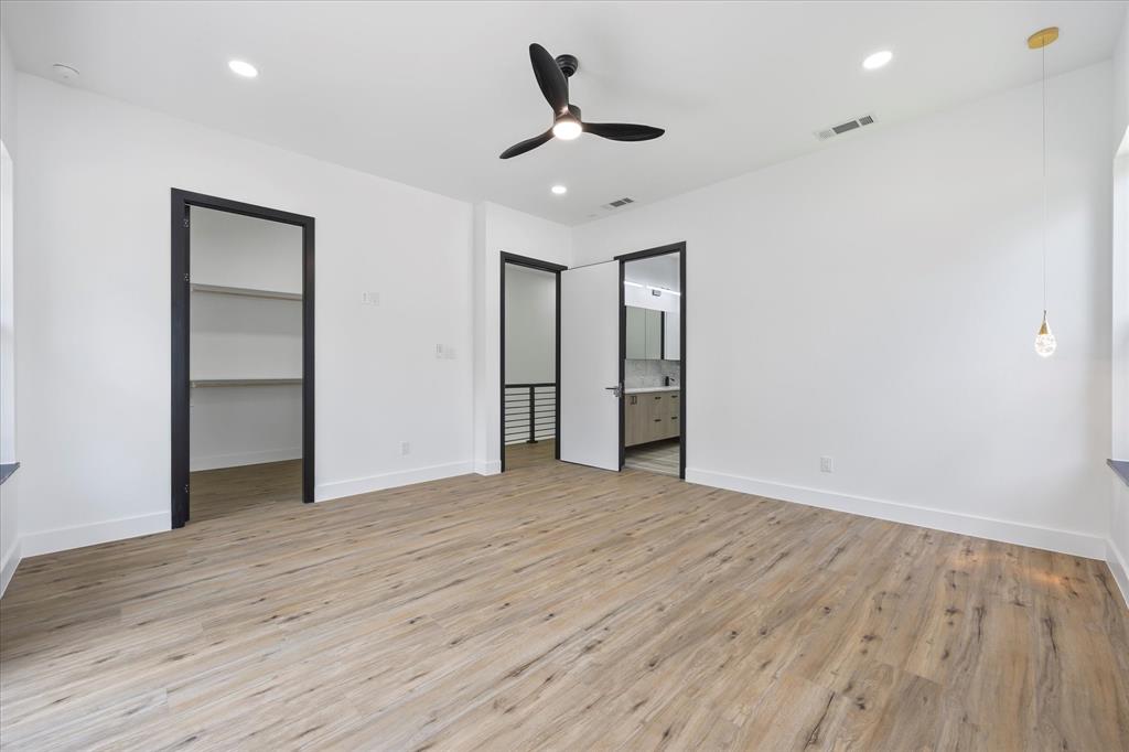2811 Rodeo Drive Quinlan, TX 75474 - Photo 21 of 38 a view of an empty room with wooden floor