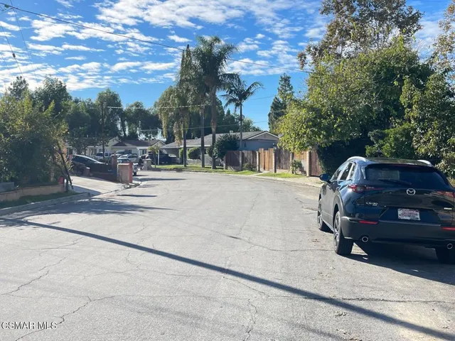a view of a patio with dining table and chairs with a fire pit